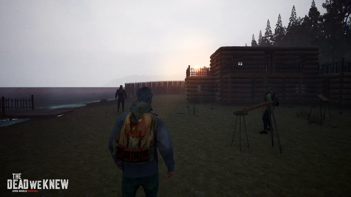 A survivor building a fortified wooden cabin shelter at twilight in The Dead We Knew